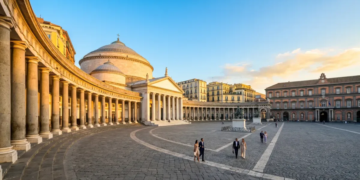 The stunning Piazza del Plebiscito illuminated during golden hour, one of the top things to do in Naples.