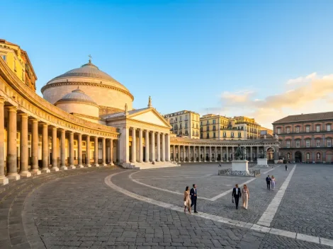 The stunning Piazza del Plebiscito illuminated during golden hour, one of the top things to do in Naples.